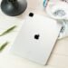 A contemporary tablet displayed on a styled flat lay, showcasing modern technology aesthetics.